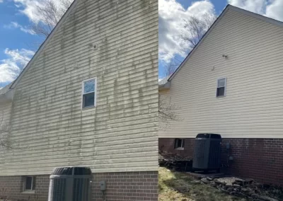 Side-by-side view of a house exterior before and after cleaning, showing dirty and clean siding.