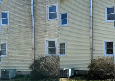 Side-by-side view of a house exterior before and after cleaning, showing dirty and clean siding.