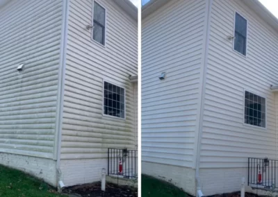 Split image of a house exterior: left side dirty, right side clean after washing, both with white siding.
